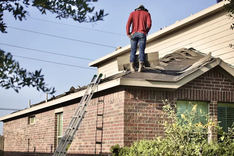 Professional roofer working on a residential roof in Nellis AFB